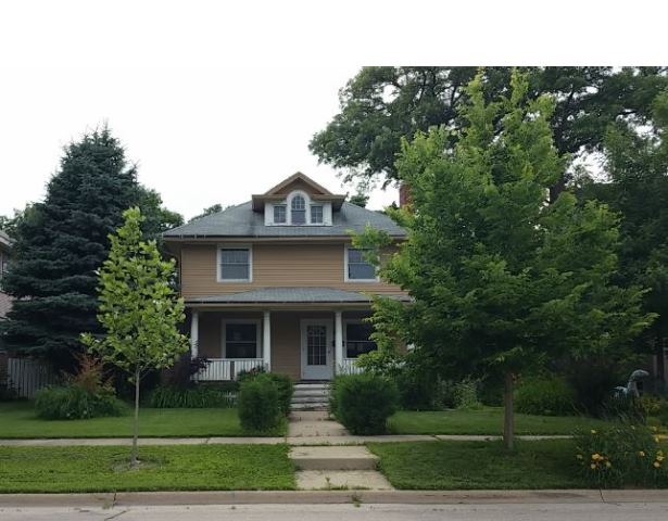 922 North Spring Street Elgin, IL 60120 - Photo 1 of 11 a front view of a house with a yard