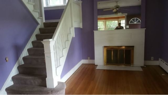 922 North Spring Street Elgin, IL 60120 - Photo 4 of 11 an entryway with wooden floor a fireplace and entryway