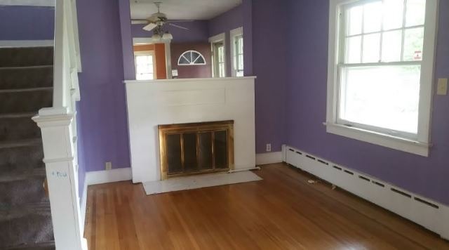 922 North Spring Street Elgin, IL 60120 - Photo 5 of 11 a view of an empty room with wooden floor and a window