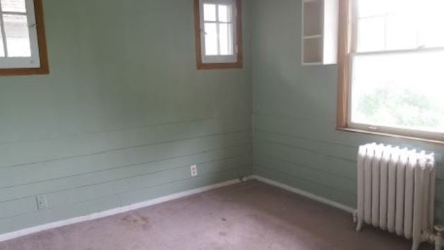 922 North Spring Street Elgin, IL 60120 - Photo 9 of 11 an empty room with a window