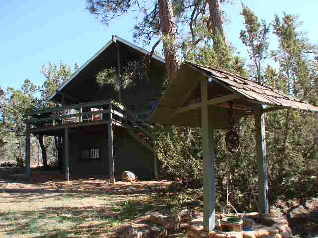3041 Aspen Road Overgaard, AZ 85933 - Photo 1 of 5 a front view of house with yard