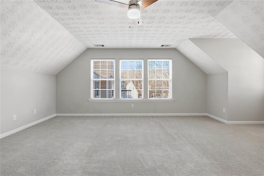3570 Bogan Mill Road Northeast Buford, GA 30519 - Photo 27 of 31 an empty room with a window