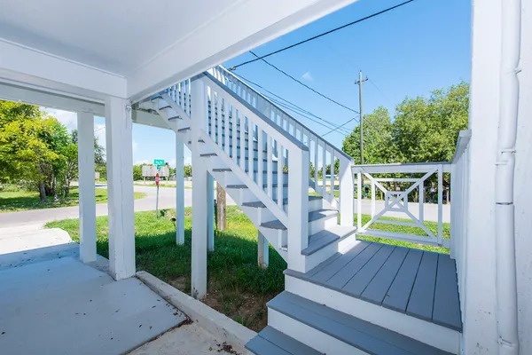 a view of a hallway with staircase