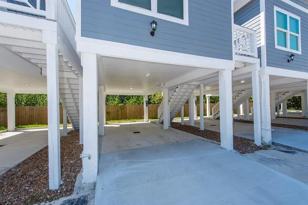 a backyard of a house with yard and glass windows