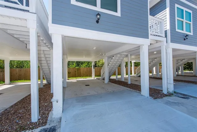 a backyard of a house with yard and glass windows