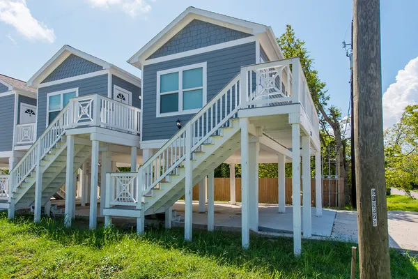 a front view of a brick building with large windows
