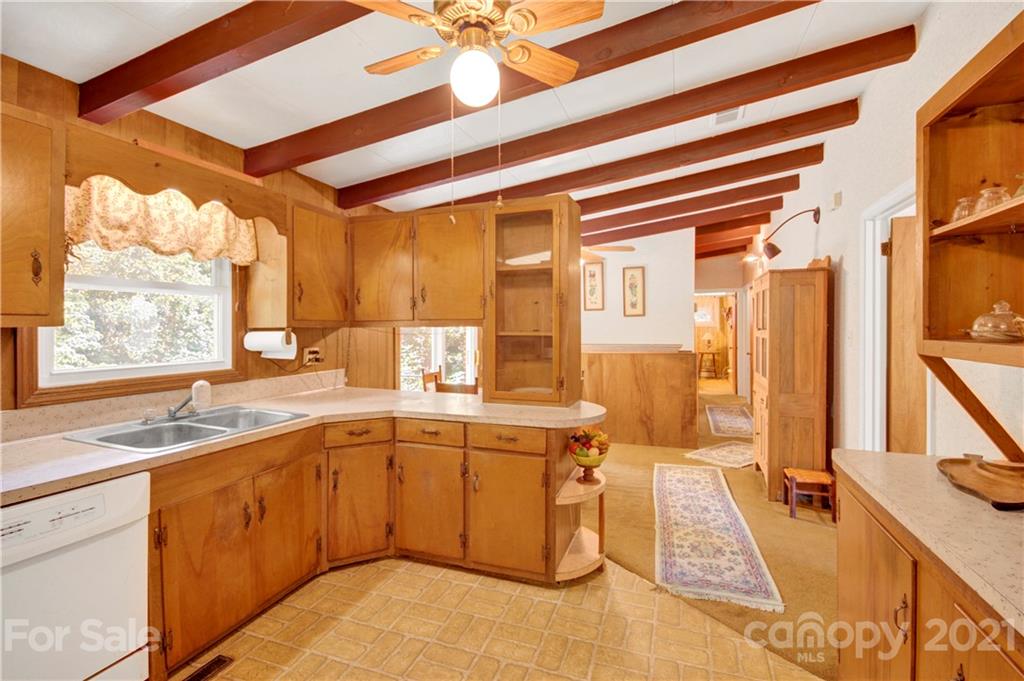 145 Azalea Road Mooresville, NC 28115 - Photo 11 of 24 a large white kitchen with a large window