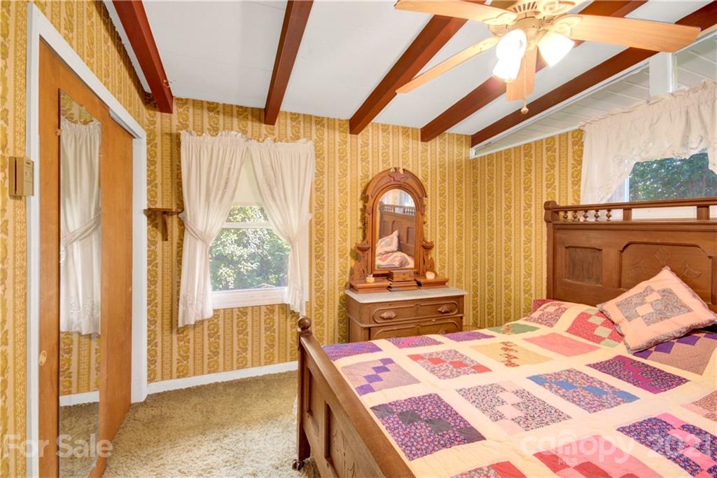 145 Azalea Road Mooresville, NC 28115 - Photo 20 of 24 a bed room with a bed and a dresser
