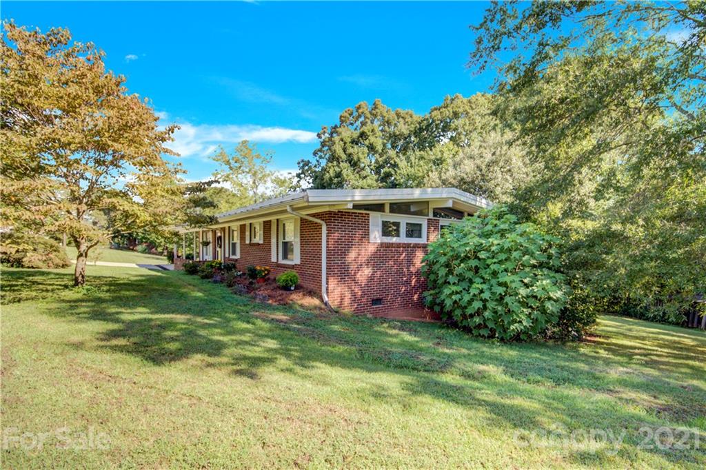 145 Azalea Road Mooresville, NC 28115 - Photo 3 of 24 a front view of a house with a yard