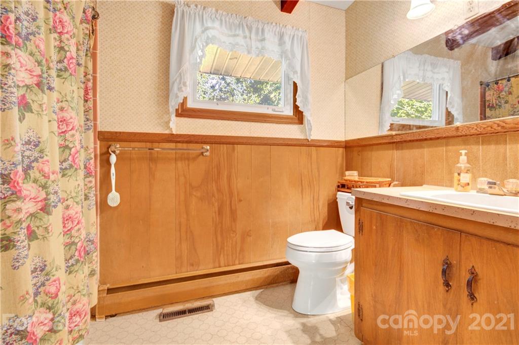 145 Azalea Road Mooresville, NC 28115 - Photo 21 of 24 a bathroom with a toilet and a sink