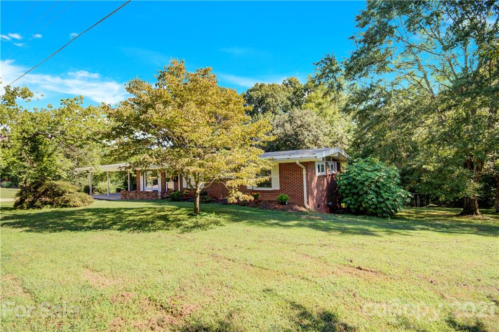 145 Azalea Road Mooresville, NC 28115 - Photo 4 of 24 a view of a house with a yard