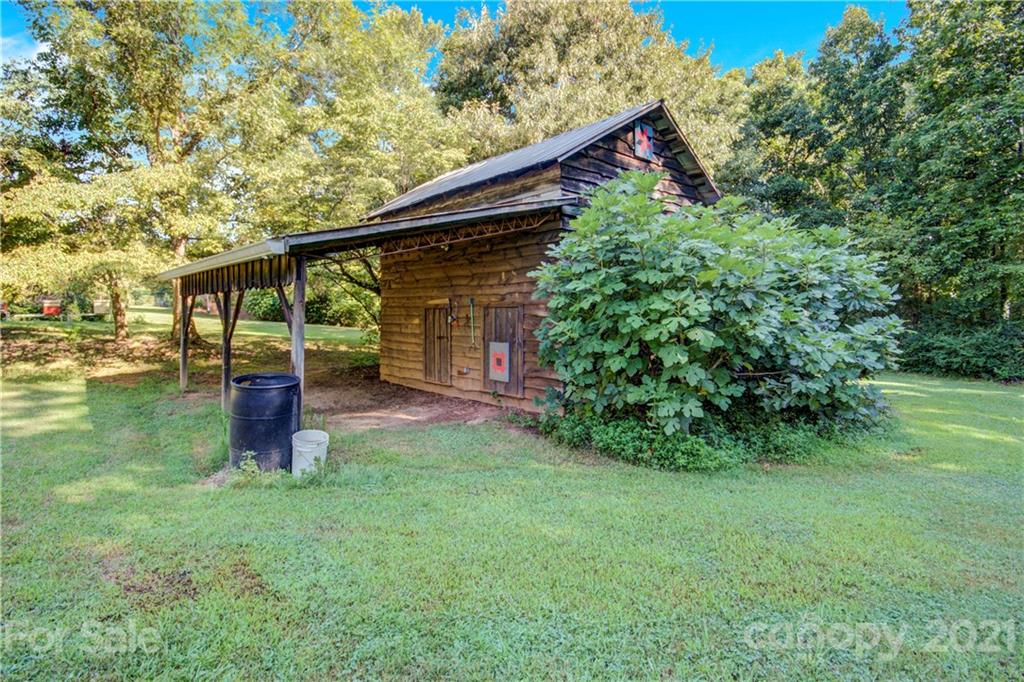 145 Azalea Road Mooresville, NC 28115 - Photo 6 of 24 a front view of a house with a yard