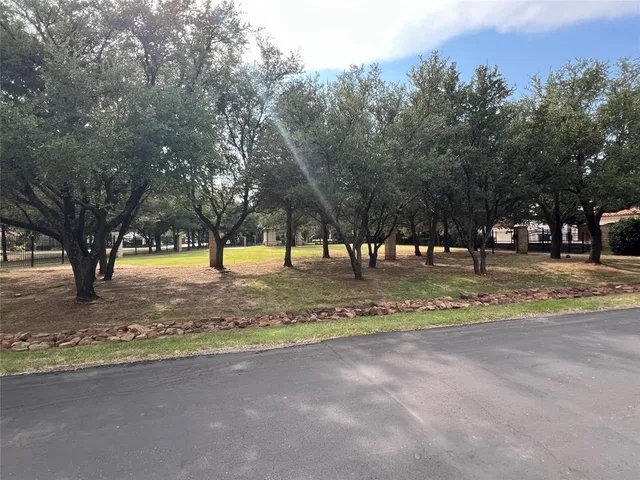 a building with trees in the background