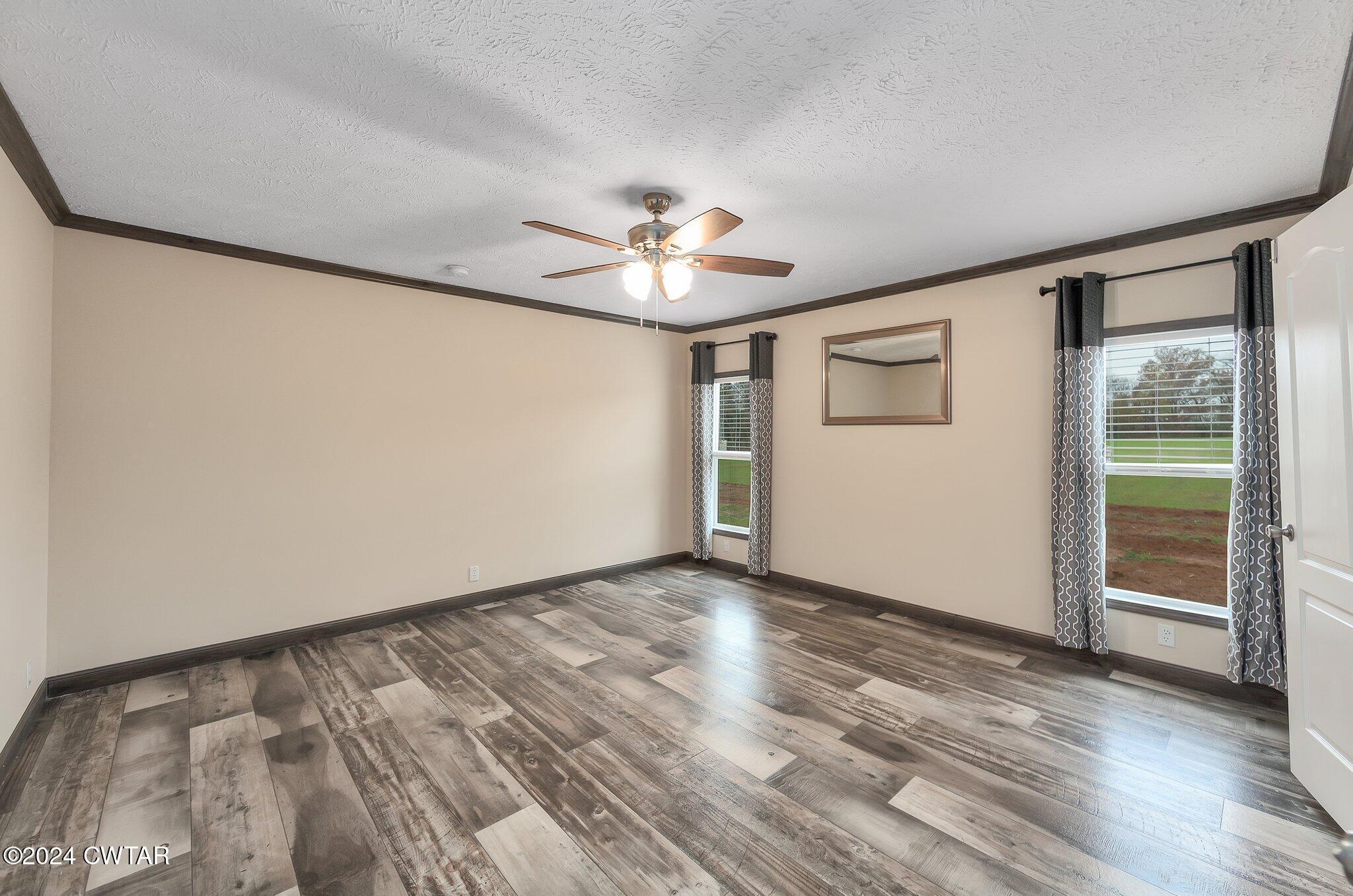 386 Bond Cemetery Road Denmark, TN 38391 - Photo 14 of 40 wooden floor in an empty room with a window