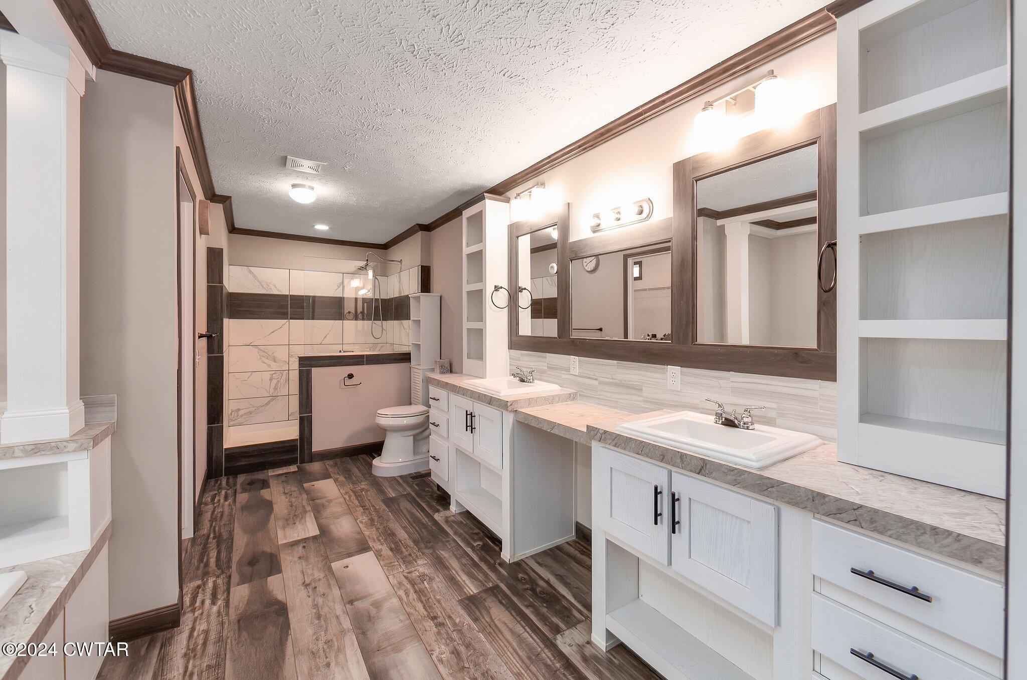 386 Bond Cemetery Road Denmark, TN 38391 - Photo 16 of 40 a large kitchen with a lot of counter space and wooden floor