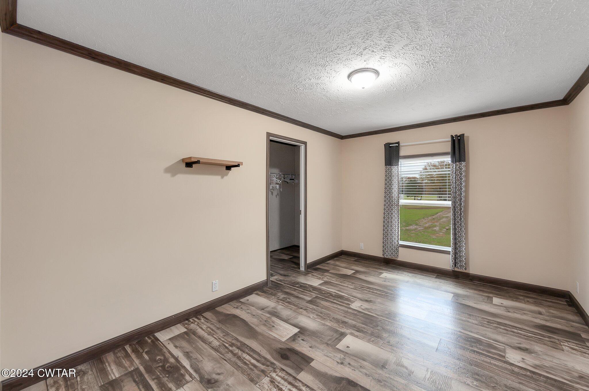 386 Bond Cemetery Road Denmark, TN 38391 - Photo 20 of 40 a view of an empty room with wooden floor