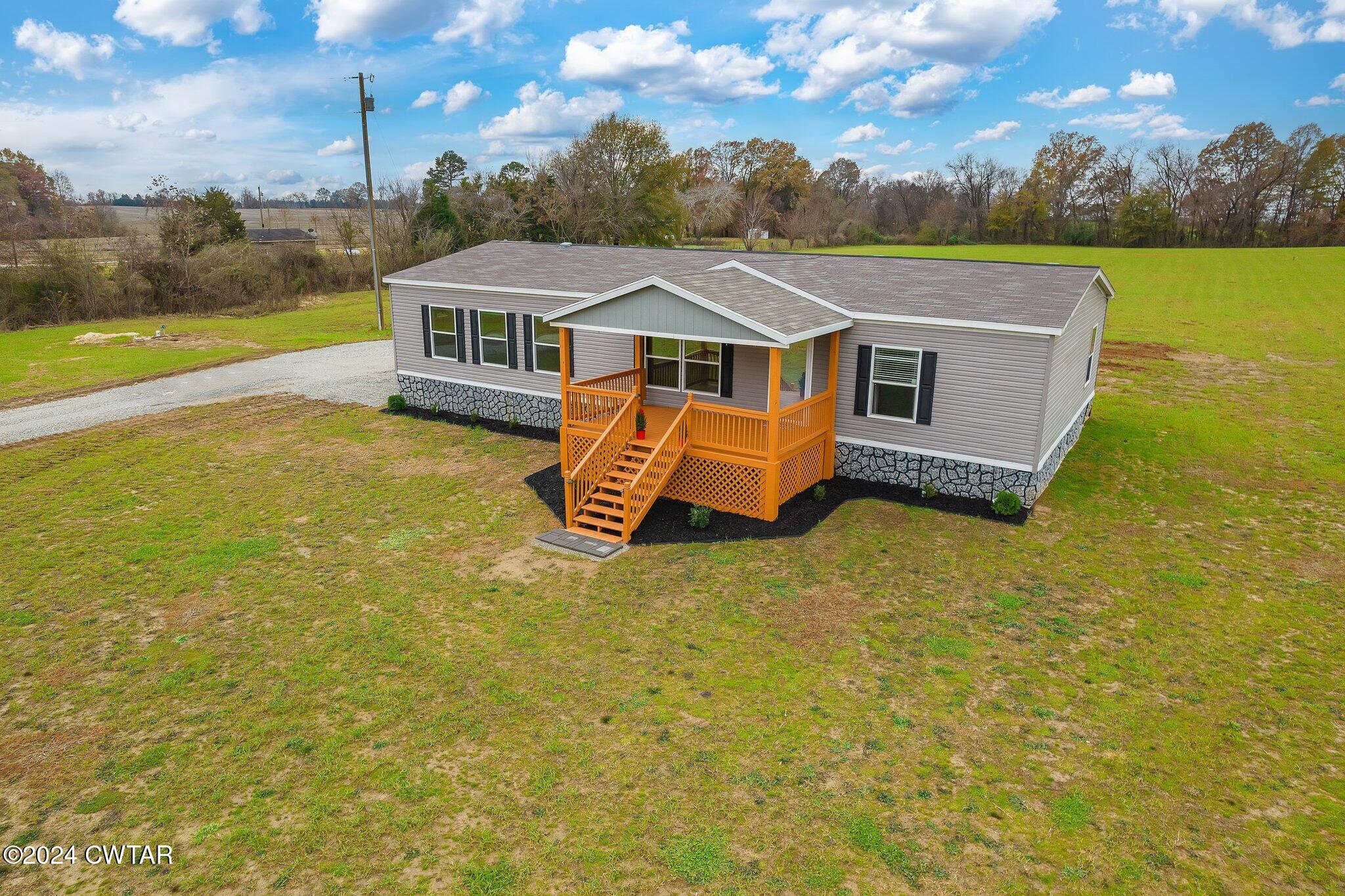 386 Bond Cemetery Road Denmark, TN 38391 - Photo 28 of 40 a aerial view of a house with a swimming pool