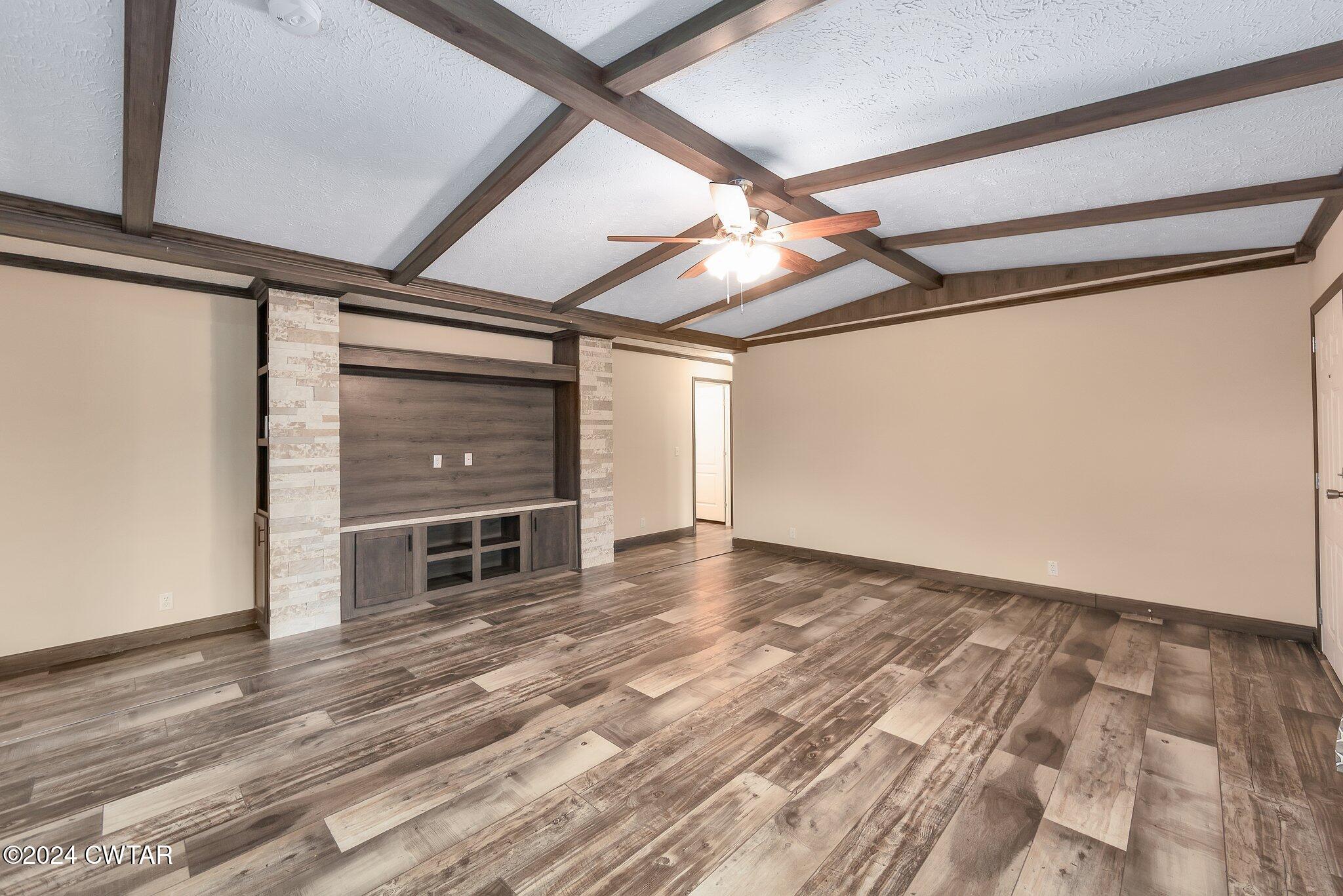 386 Bond Cemetery Road Denmark, TN 38391 - Photo 4 of 40 a view of empty room with wooden floor and fan