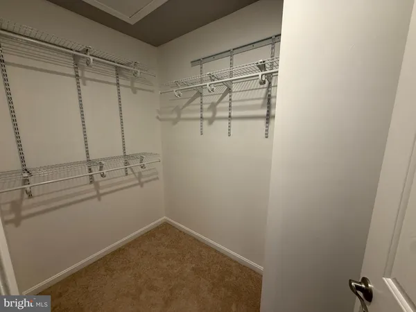 a view of a room with racks on the wall