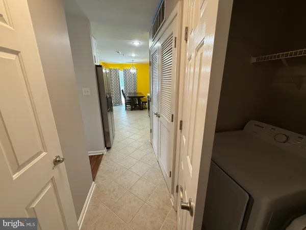 a view of a bathroom from a hallway