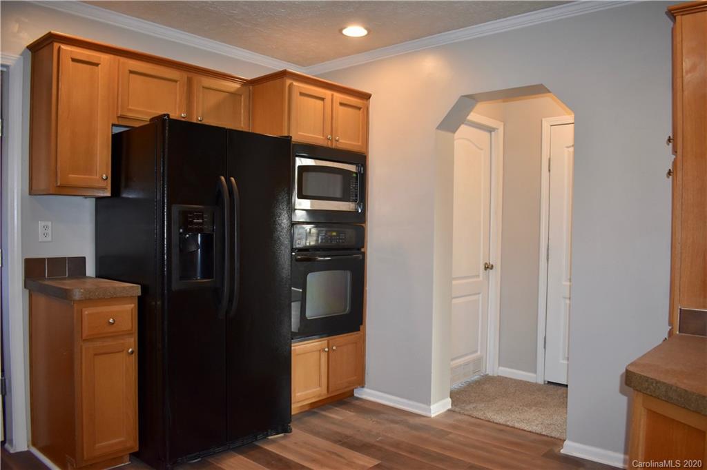 498 Ted Smith Road Rutherfordton, NC 28139 - Photo 13 of 38 a kitchen with stainless steel appliances a refrigerator and a stove