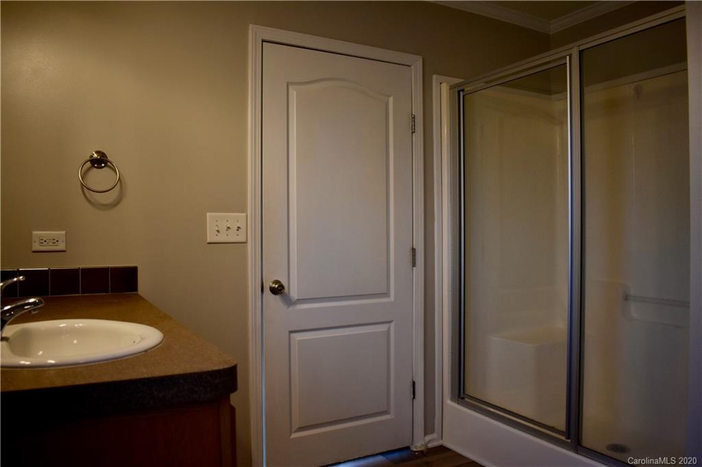 498 Ted Smith Road Rutherfordton, NC 28139 - Photo 21 of 38 a bathroom with a sink and mirror