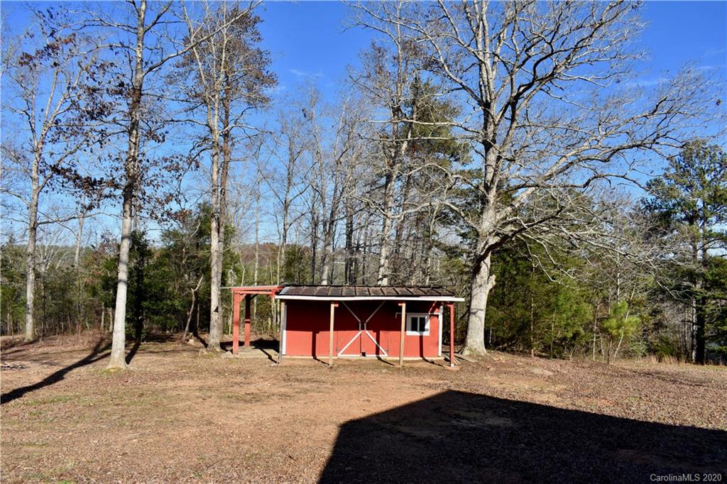 498 Ted Smith Road Rutherfordton, NC 28139 - Photo 28 of 38 a view of a backyard with large trees