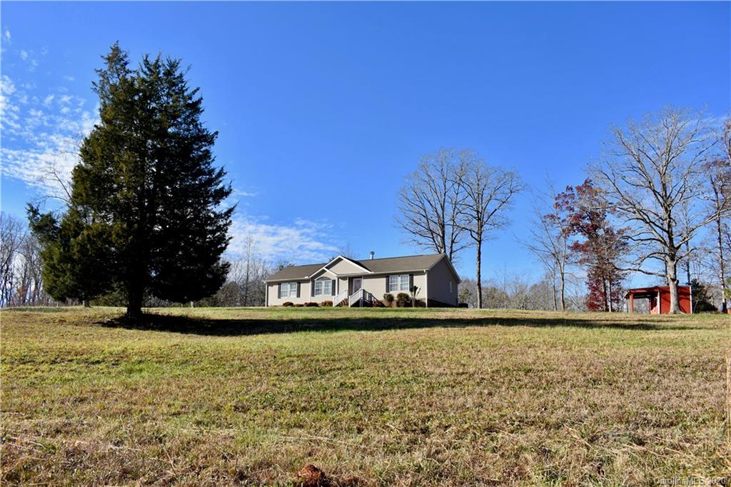 498 Ted Smith Road Rutherfordton, NC 28139 - Photo 4 of 38 a front view of a house with a yard