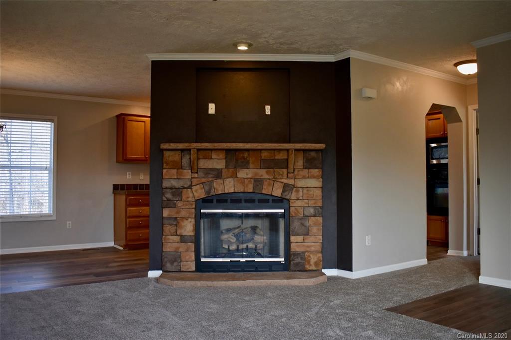 498 Ted Smith Road Rutherfordton, NC 28139 - Photo 8 of 38 a living room with furniture and a fireplace