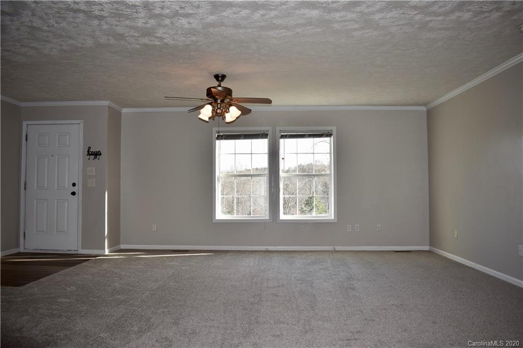 498 Ted Smith Road Rutherfordton, NC 28139 - Photo 9 of 38 an empty room with a window