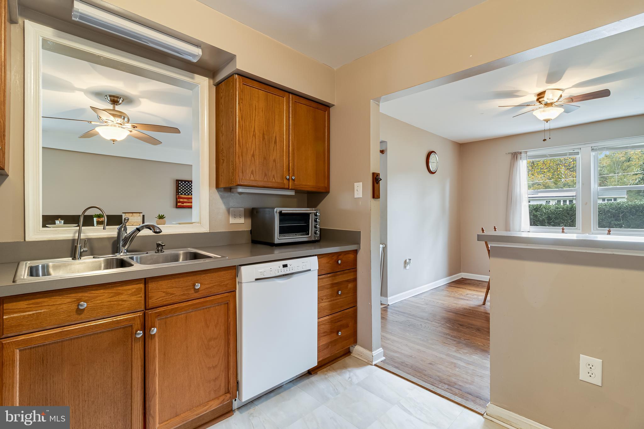 14305 Duckett Road Brandywine, MD 20613 - Photo 13 of 35 a kitchen with a sink cabinets and window