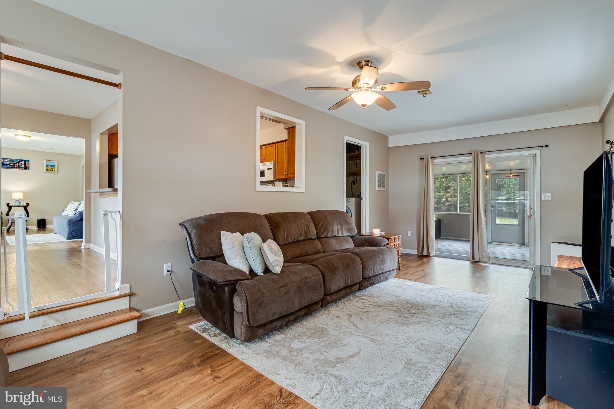 14305 Duckett Road Brandywine, MD 20613 - Photo 14 of 35 a living room with furniture and a flat screen tv