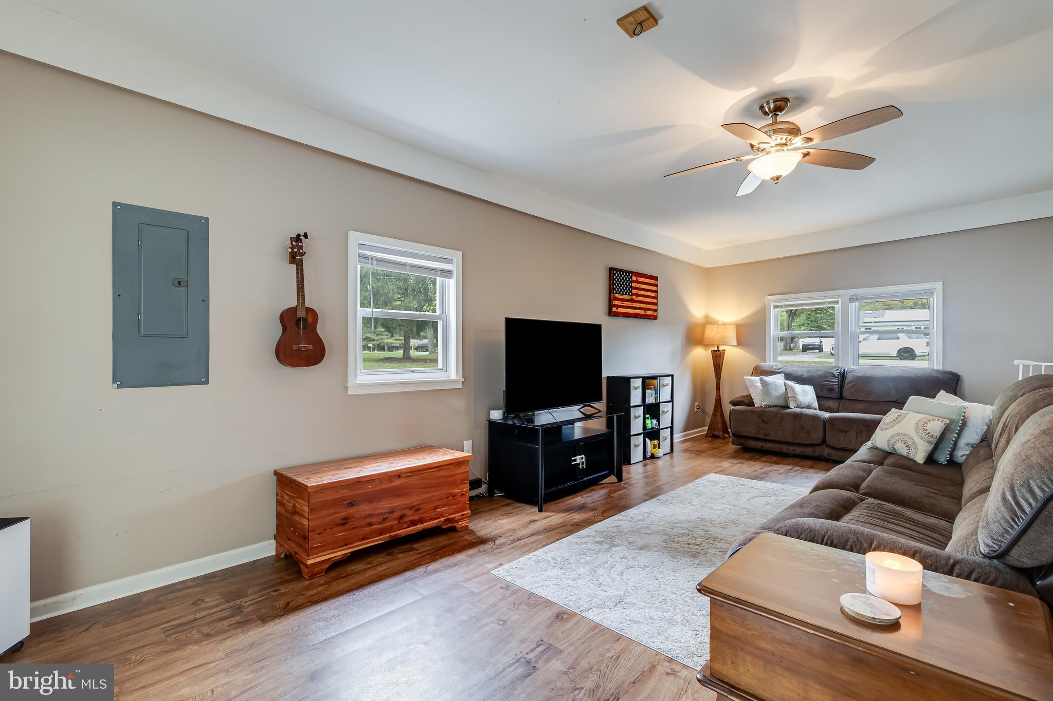 14305 Duckett Road Brandywine, MD 20613 - Photo 16 of 35 a living room with furniture and a flat screen tv