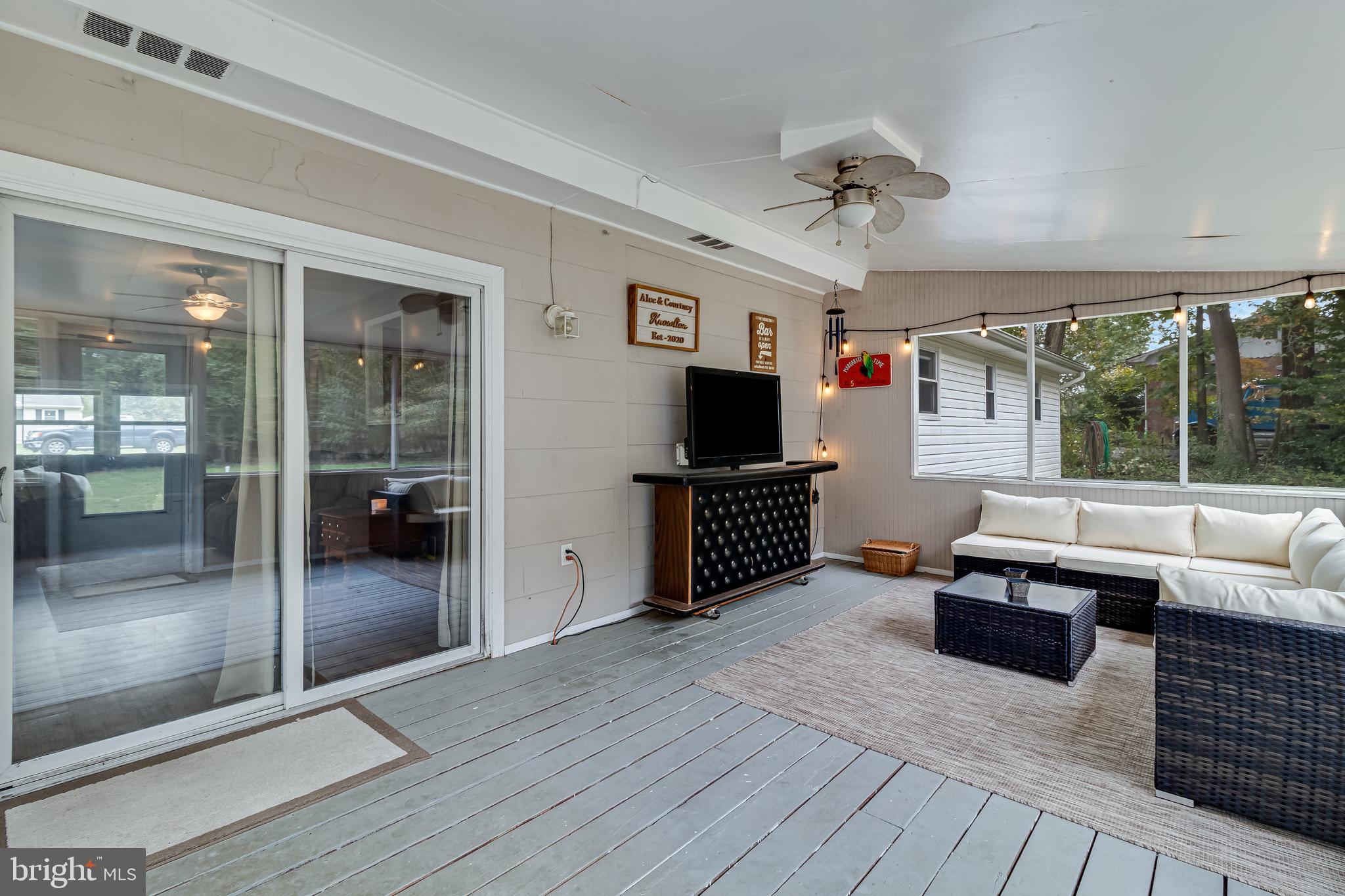 14305 Duckett Road Brandywine, MD 20613 - Photo 18 of 35 a living room with furniture and a flat screen tv