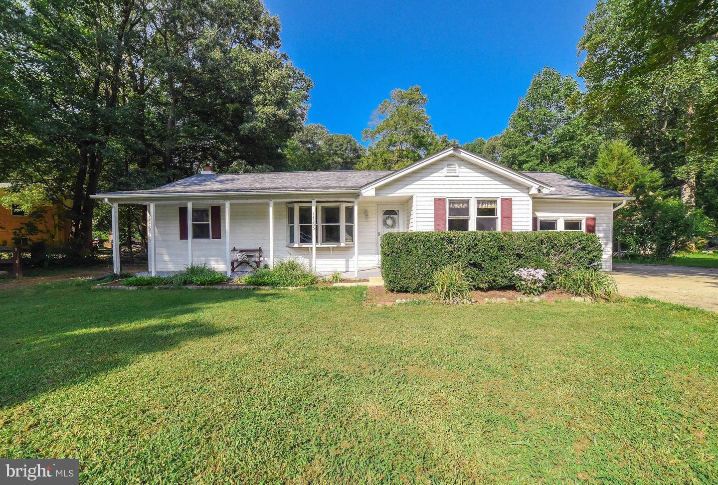 14305 Duckett Road Brandywine, MD 20613 - Photo 2 of 35 a view of a house with a yard and potted plants