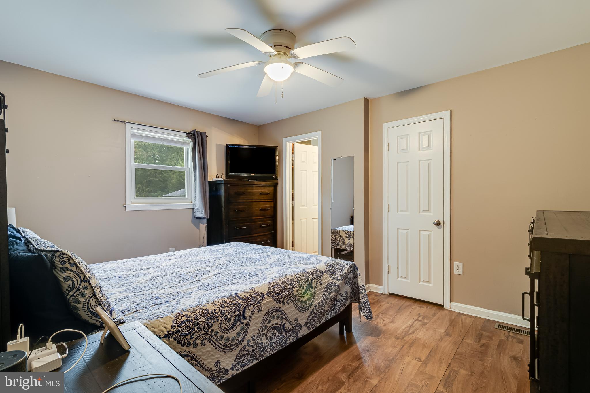 14305 Duckett Road Brandywine, MD 20613 - Photo 23 of 35 a bedroom with a bed closet and a window