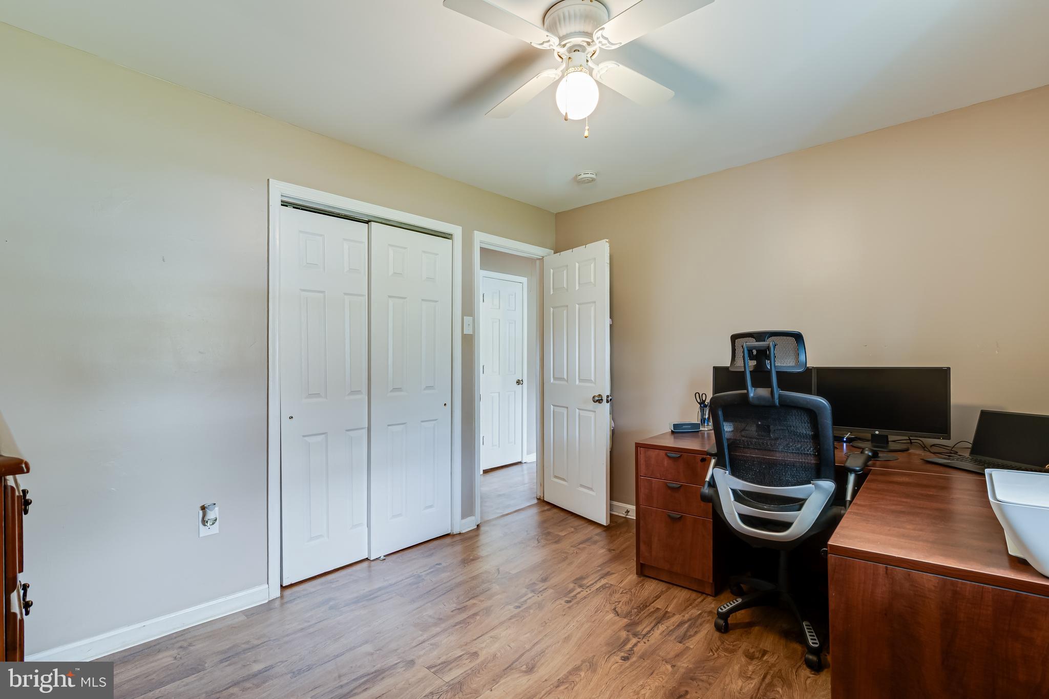 14305 Duckett Road Brandywine, MD 20613 - Photo 28 of 35 a workspace with furniture and wooden floor