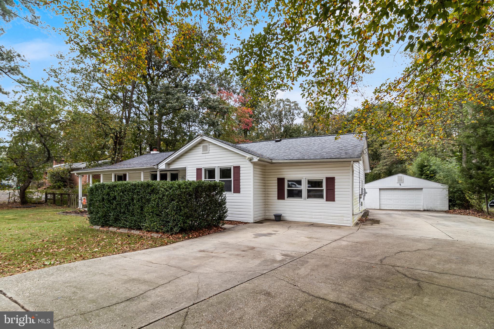 14305 Duckett Road Brandywine, MD 20613 - Photo 3 of 35 a front view of a house with a garden