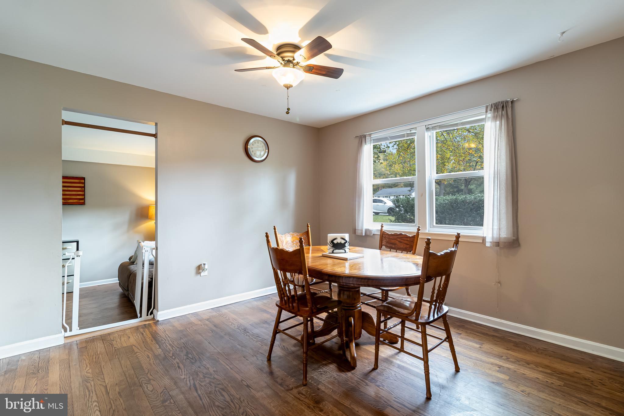 14305 Duckett Road Brandywine, MD 20613 - Photo 8 of 35 a view of a dining room with furniture window and wooden floor