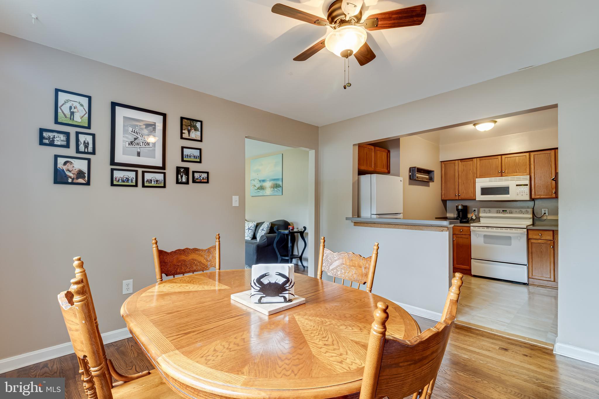 14305 Duckett Road Brandywine, MD 20613 - Photo 10 of 35 a view of a dining room with furniture and wooden floor