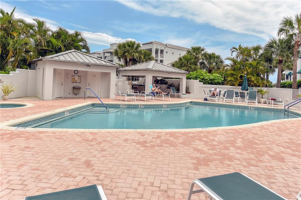 145 Northeast Edgewater Drive, Unit 4105 Stuart, FL 34996 - Photo 2 of 36 a view of a house with a swimming pool