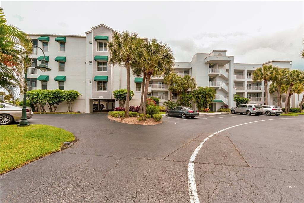 145 Northeast Edgewater Drive, Unit 4105 Stuart, FL 34996 - Photo 29 of 36 a view of a street with cars
