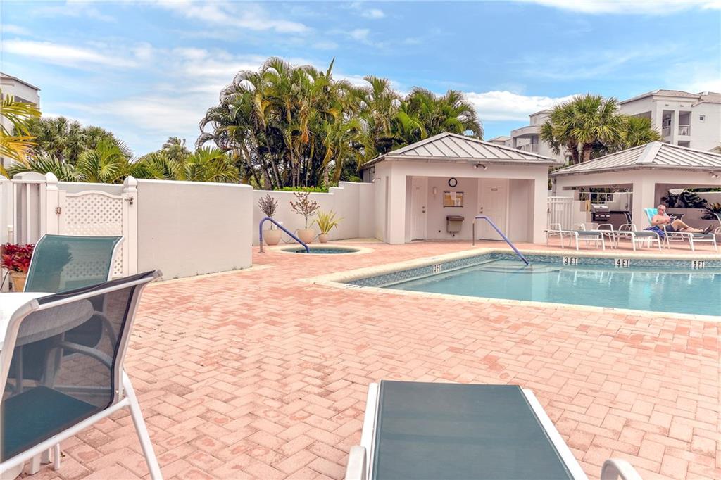 145 Northeast Edgewater Drive, Unit 4105 Stuart, FL 34996 - Photo 35 of 36 a view of a house with pool and yard