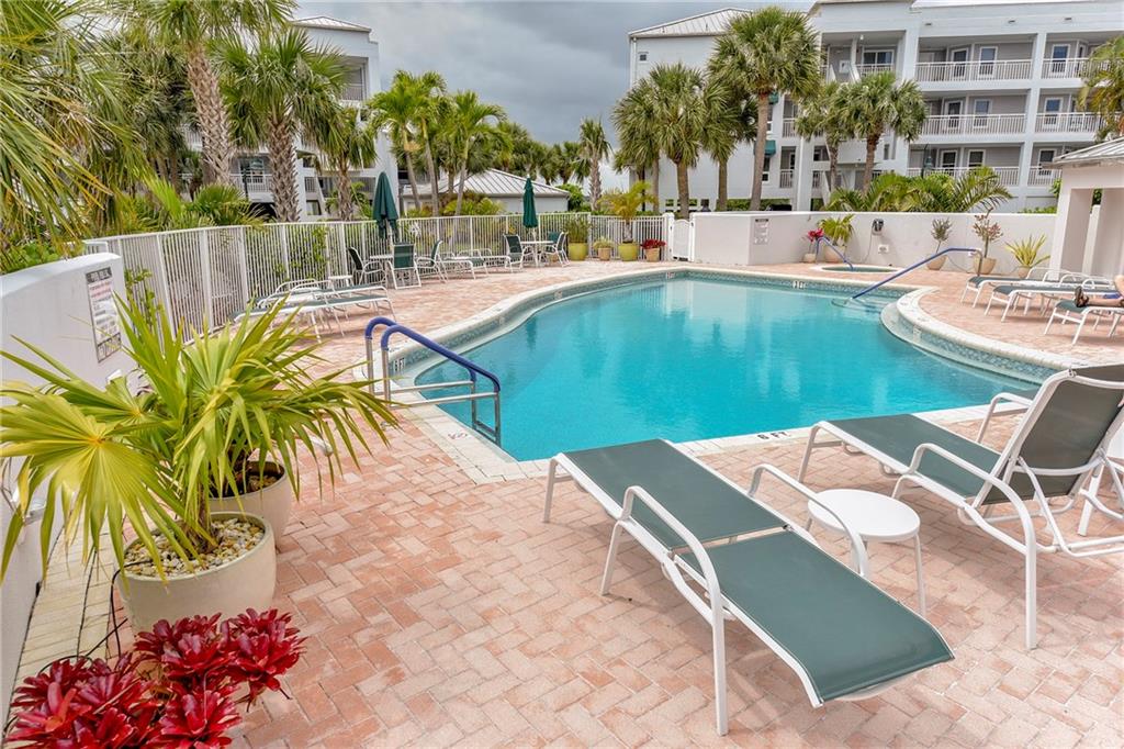 145 Northeast Edgewater Drive, Unit 4105 Stuart, FL 34996 - Photo 36 of 36 a view of a swimming pool with a patio