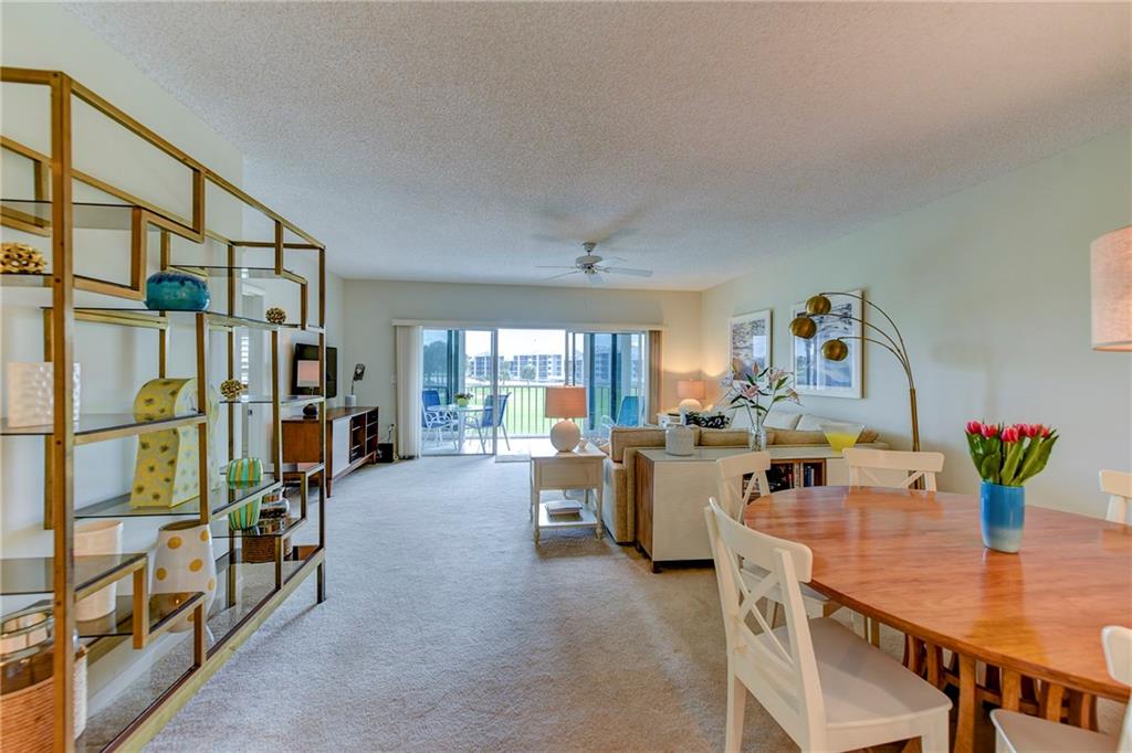 145 Northeast Edgewater Drive, Unit 4105 Stuart, FL 34996 - Photo 7 of 36 a view of a dining room with furniture window and outside view