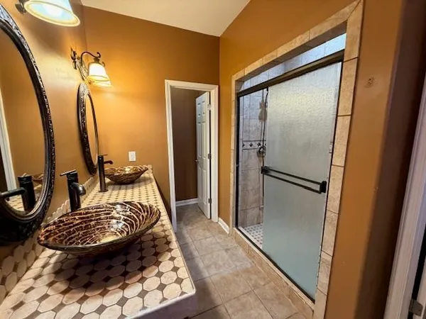 a bathroom with a tub and a mirror