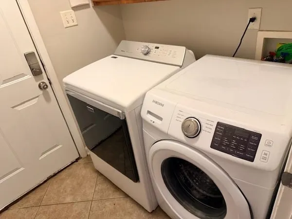 a utility room with dryer and washer