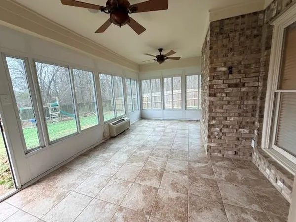 a view of empty room with windows