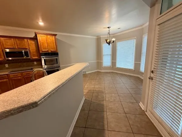 a view of a kitchen with a sink