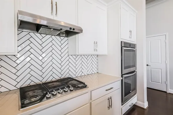 a kitchen with a stove and a microwave